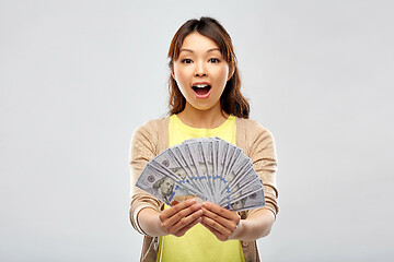 Image showing asian woman with hundreds of dollar money