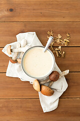 Image showing mushroom cream soup in bowl on cutting board