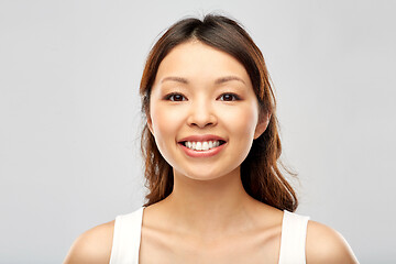 Image showing face of happy smiling young asian woman