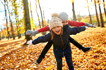 Image showing happy children having fun at autumn park