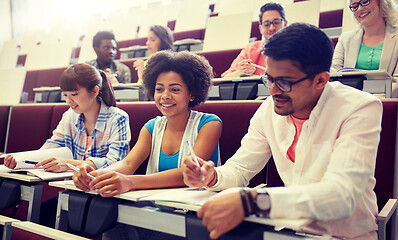 Image showing group of students with notebooks in lecture hall