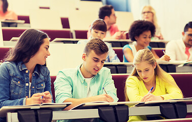 Image showing group of students with notebooks in lecture hall