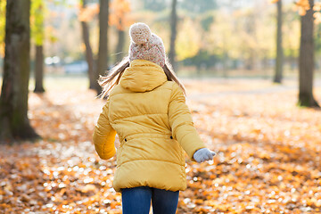 Image showing happy girl running in autumn park