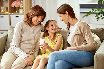 Image showing mother, daughter and grandmother with smartphone