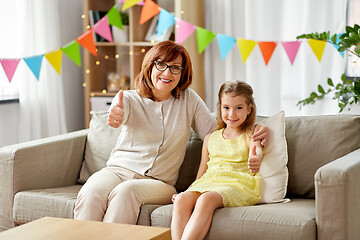 Image showing grandmother and granddaughter on birthday at home