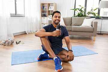 Image showing indian man drinking water after training at home