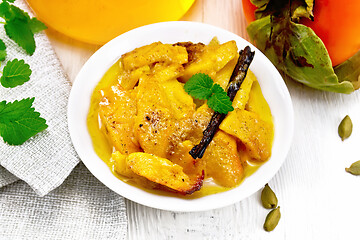 Image showing Persimmons baked with honey in dish on table