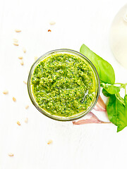 Image showing Pesto in glass jar on light board top