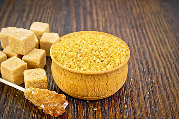 Image showing Sugar brown in wooden bowl on board