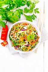 Image showing Salad of cucumber in bowl on white board top