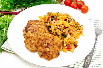 Image showing Fritters meat with cabbage in plate on white board