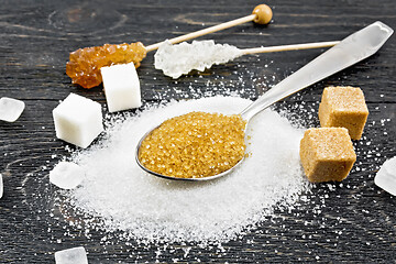 Image showing Sugar brown in spoon and white on black board