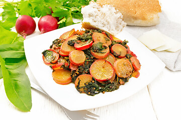 Image showing Radish with spinach and spices in plate on light board