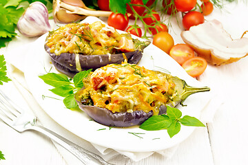 Image showing Eggplant stuffed smoked brisket in plate on white board