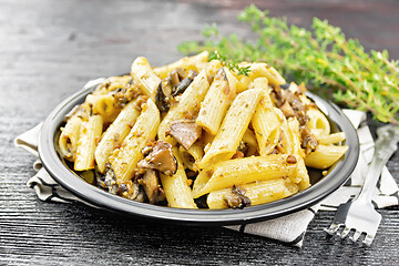 Image showing Pasta with mushrooms in plate on black board