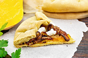 Image showing Pie with pumpkin and fried onions on board