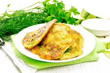 Image showing Pancakes of zucchini on towel