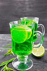 Image showing Lemonade Tarragon in two goblets on black wooden board