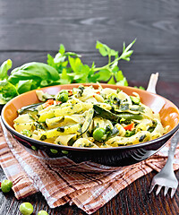 Image showing Tagliatelle with green vegetables on kitchen towel