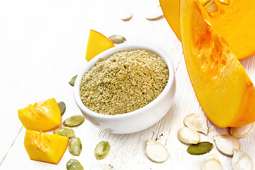 Image showing Flour pumpkin in white bowl on board