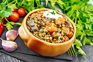 Image showing Lentils with eggplant and tomatoes in bowl on table