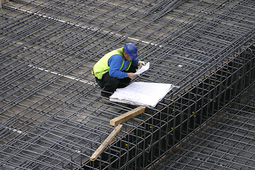 Image showing Project Manager reading the site plans