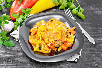 Image showing Chicken with pepper in plate on wooden board