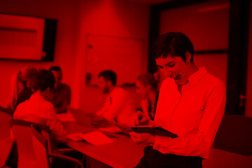 Image showing business woman on meeting  using tablet