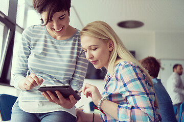 Image showing Pretty Businesswomen Using Tablet In Office Building during conf