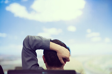 Image showing young man dreaming clouds on presentation