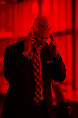 Image showing senior business man talk on mobile phone