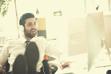 Image showing relaxed young business man at office