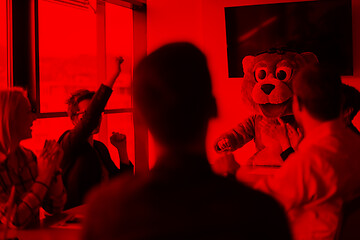 Image showing boss dresed as bear having fun with business people in trendy of