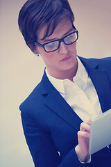 Image showing business woman working on tablet