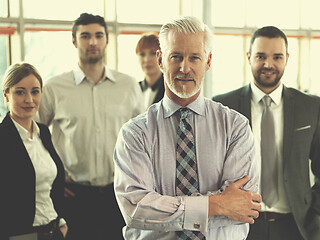 Image showing senior business man with his team at office