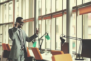 Image showing African American businessman talk by phone