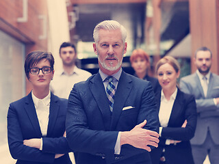 Image showing senior business man with his team at office