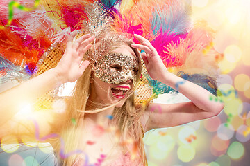 Image showing Beautiful young woman in carnival mask