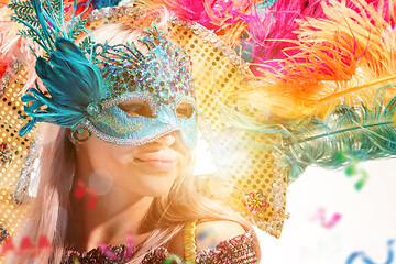 Image showing Beautiful young woman in carnival mask