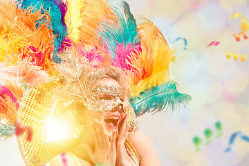 Image showing Beautiful young woman in carnival mask