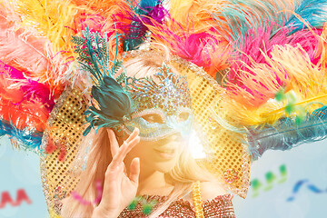 Image showing Beautiful young woman in carnival mask