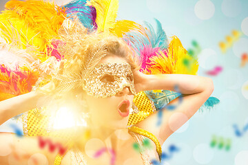 Image showing Beautiful young woman in carnival mask