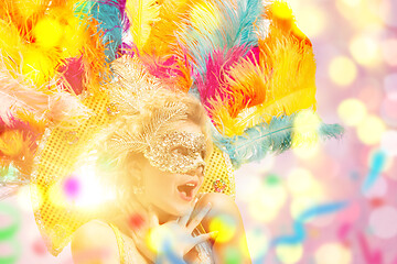 Image showing Beautiful young woman in carnival mask