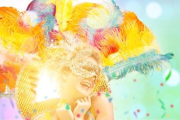 Image showing Beautiful young woman in carnival mask