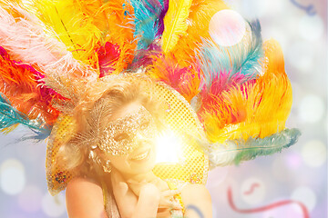 Image showing Beautiful young woman in carnival mask