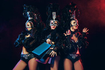 Image showing young beautiful dancers posing on studio background