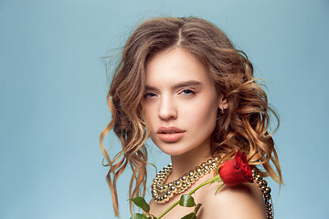 Image showing Beautiful young girl in studio with pearl jewelry - earrings, bracelet, necklace.