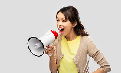 Image showing asian woman speaking to megaphone