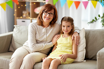 Image showing grandmother and granddaughter on birthday at home