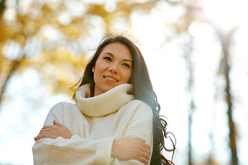 Image showing portrait of happy young woman in autumn park